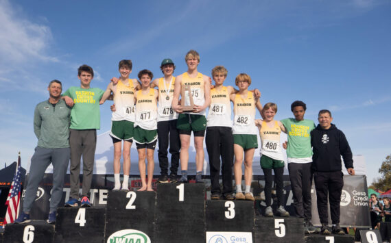John Decker Photo
The Vashon boys cross-country team celebrates its fourth-place podium finish at the state championships in Pasco on Nov. 8.