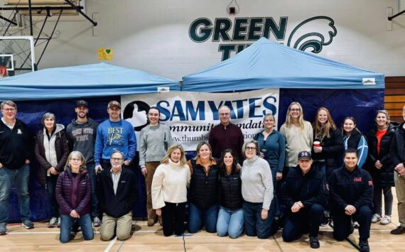 Courtesy Photo
Jill Yates (fourth from left, kneeling) and the team of volunteers assembled for a heart screening event held on Nov. 4 at Vashon High School.