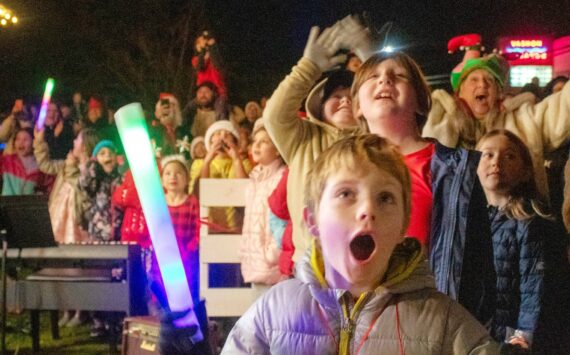 Alex Bruell Photo
Kids and adults react as the great tree lights up next to the Vashon Presbyterian Church at WinterFest 2024.