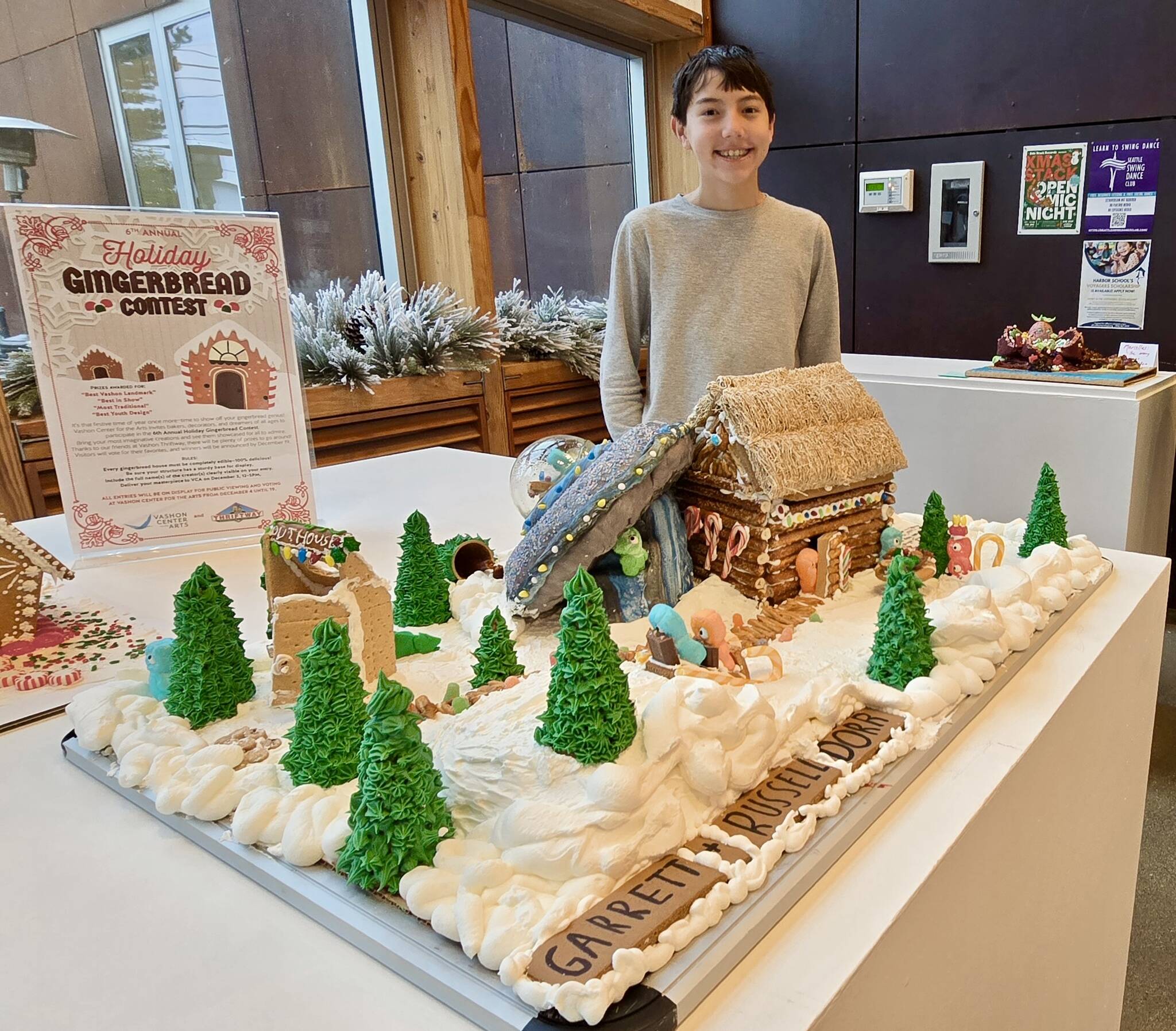 Garrett Dorr, an eighth-grade student at Harbor School, stands with his gingerbread entry at the Vashon Center for the Arts holiday gingerbread contest. (Courtesy Photo)