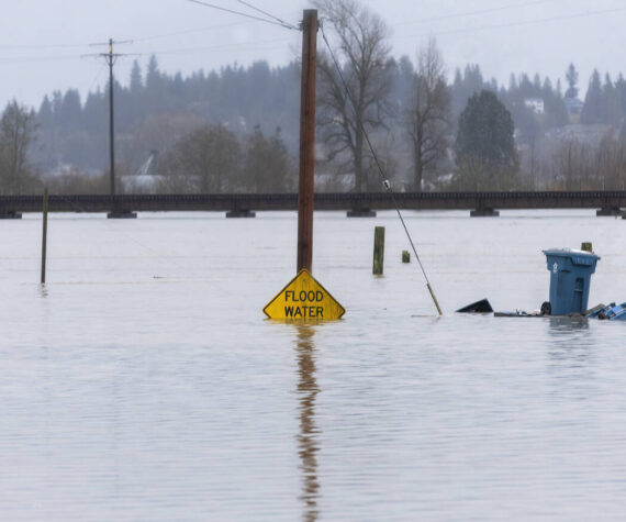 <p>Floodwater from the Snohomish River partially covers a flood water sign on Thursday, Dec. 11, 2025 in Snohomish, Washington. (Sound Publishing photo)</p>