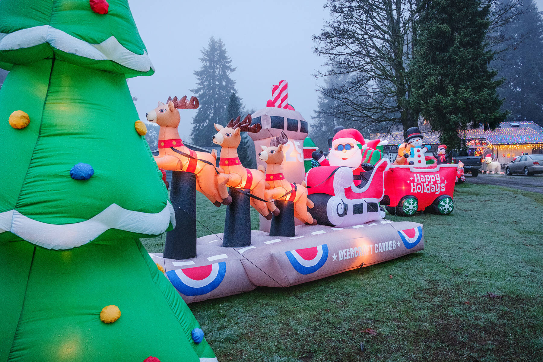 Lewis Roggenbucks home at 18911 Ridge Road SW features a festive lighted display with an inflatable Santa and reindeer. (Terry Donnelly Photo)