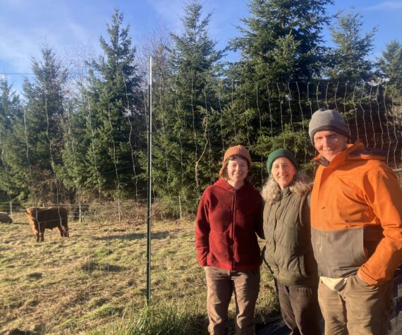 <p>Leslie Brown Photo</p>
                                <p>Olivia Mancl (left) stands with Joanne Jewell and Rob Peterson at Plum Forest Farm on Vashon.</p>