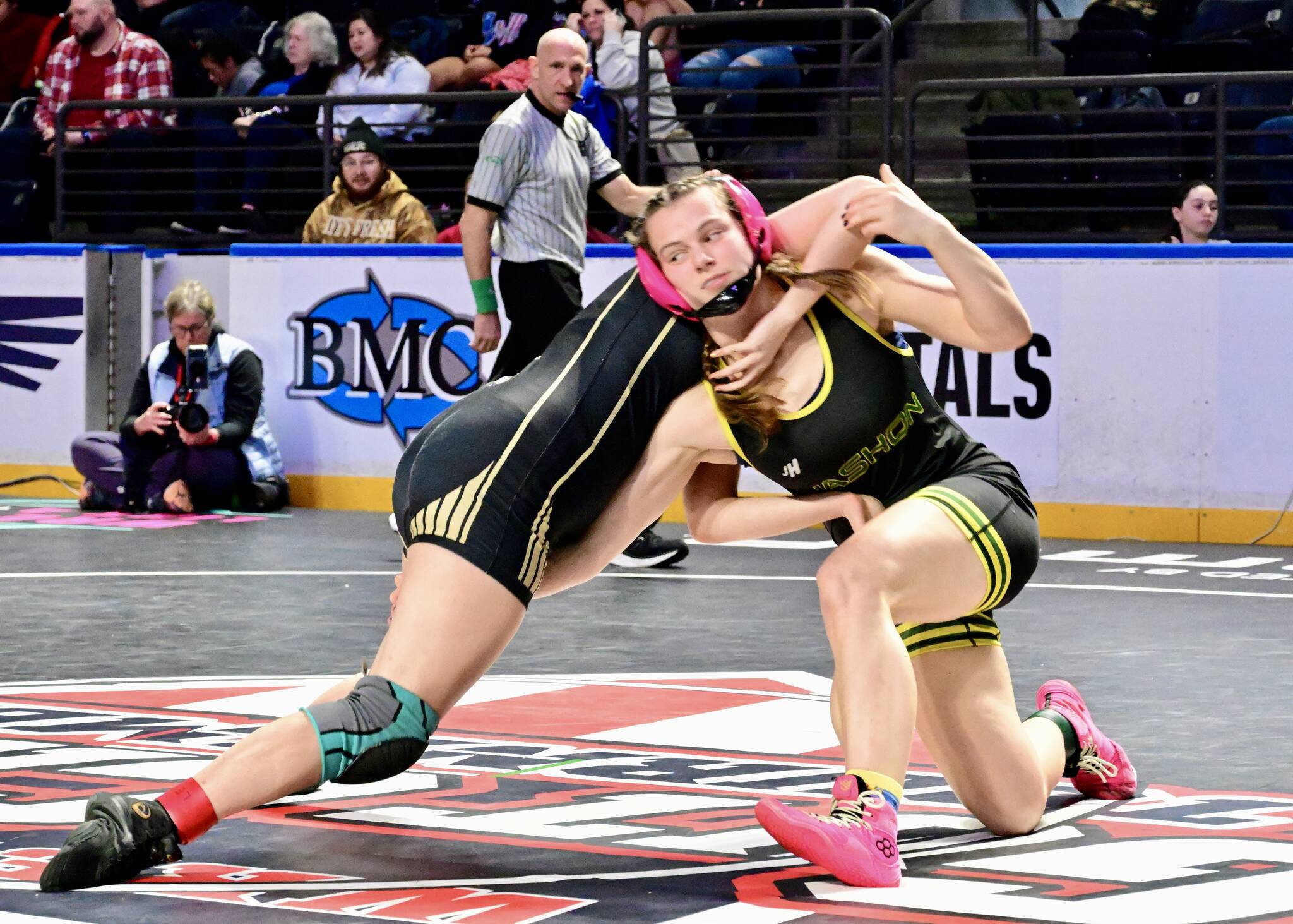 Lena Puz (right) wrestles during the Gut Check tournament in Kent earlier this season. The Vashon senior is defending her state title at the Mat Classic Feb. 20-21. (Tony Puz Photo)
Lena Puz (right) wrestles during the Gut Check tournament in Kent earlier this season. The Vashon senior is defending her state title at the Mat Classic Feb. 20-21. (Tony Puz Photo)