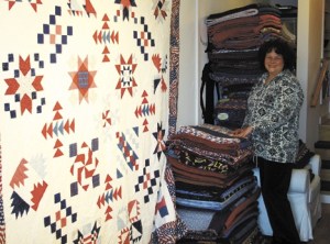 Sue Nebeker displays one of the project’s most special quilts