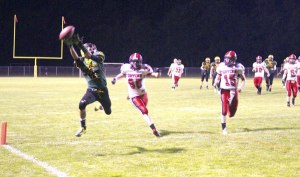 The ball sails just over the fingertips of Nick Fox-Edele