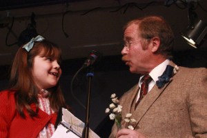 Laura Erickson and Toby Nichols share a moment onstage during Drama Dock's radio/reader/s theater version of 'It's a Wonderful Life.'