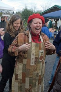 Joanne Jewell puts the specially made winner's apron on Jasper Forrester after she was named this year's winner of the annual pumpkin pie contest. The apron was made two years ago by Rebecca Wittman
