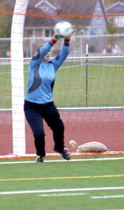 Sophie Nespor leaps to save Charles Wright’s final kick from the penalty mark and give Vashon the shootout win.