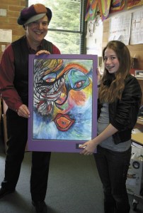 Jeffrey Zheutlin and Kaia Boonzaier pose with Kaia's self-portrait.