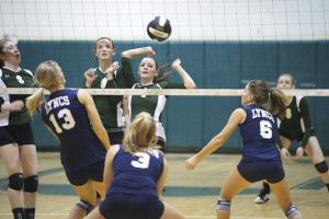 All eyes are on the volleyball as it drops for a Vashon point against Lynden Christian. Pirates