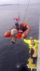 A ferry rider took this photo of ferry workers rescuing a man who jumped off the Issaquah ferry on Friday.