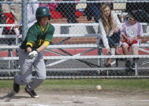 Michael Bernheisel makes a hit during Vashon’s game against Orting High School on Tuesday