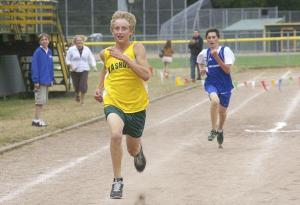 McMurray runner Jeffrey Parrish out-kicks Life Christian’s Tyler Miller to win the middle school race at Thursday’s home cross country meet.