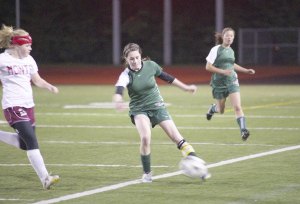 Pirate captain Carlyle Scott moves the ball up the left side past Montesano defender Elissa Mendenhall in Tuesday’s opening state tournament game.