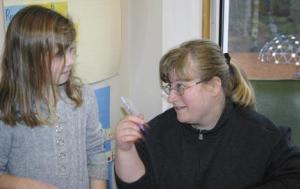 Alisa Church works with a student at Chautauqua