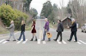 A group of island musicians each wrote one song using the same guitar