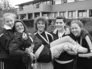 Novice quad girls celebrate their gold medal at Brentwood. They are