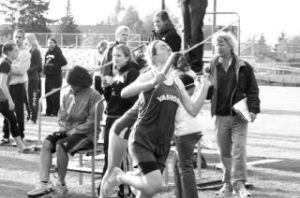 Vashon sophomore Kate Straube edges a Charles Wright runner at the finish line to take second place in the 4x400-meter relay in the final day of the Nisqually League 1A track meet last Wednesday.