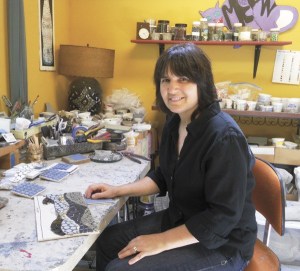 Elaine Summers created a moscaicked guitar that will be auctioned off Saturday night.