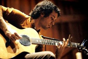 Trace Bundy has been called the “Acoustic Ninja” because of the physical way he works his guitar.