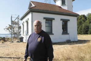 Capt. Joe Wubbold is sick about the theft. Behind him is the metal platform where the pair of foghorns used to sit.
