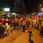 Revelers gather on Vashon Highway in front of the town Christmas tree. (John De Groen Photo)