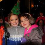 Two bundled-up girls pose for a photo during Winterfest festivities. (Susan Riemer/Staff Photo)