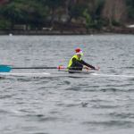 Decked out in a Santa hat, Vashon Island Rowing Club junior Aidan Teachout takes to the water in a single during the VIRC Solstice Scrimmage on Sunday. (Jordan Petram Photo)