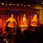 Decked out in Santa outfits, island trio The S Curves perform at the Red Bike during last year&rsquo;s Will Sing For Food benefit (Pete Welch Photo)