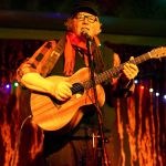 John Van Amerongen plays guitar and sings at Will Sing for Vashon. (Pete Welch Photo)