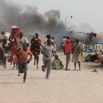 South Sudanese refugees flee a United Nations base while under attack in Malakai last February. (Justin Lynch/AFP/Getty Images)