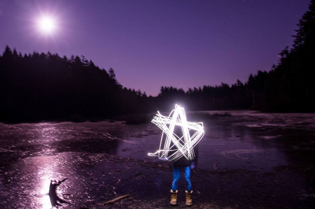 A full moon lights up the sky above Fisher Pond as a glowing star takes shape. (Cassie Bergman Photo)