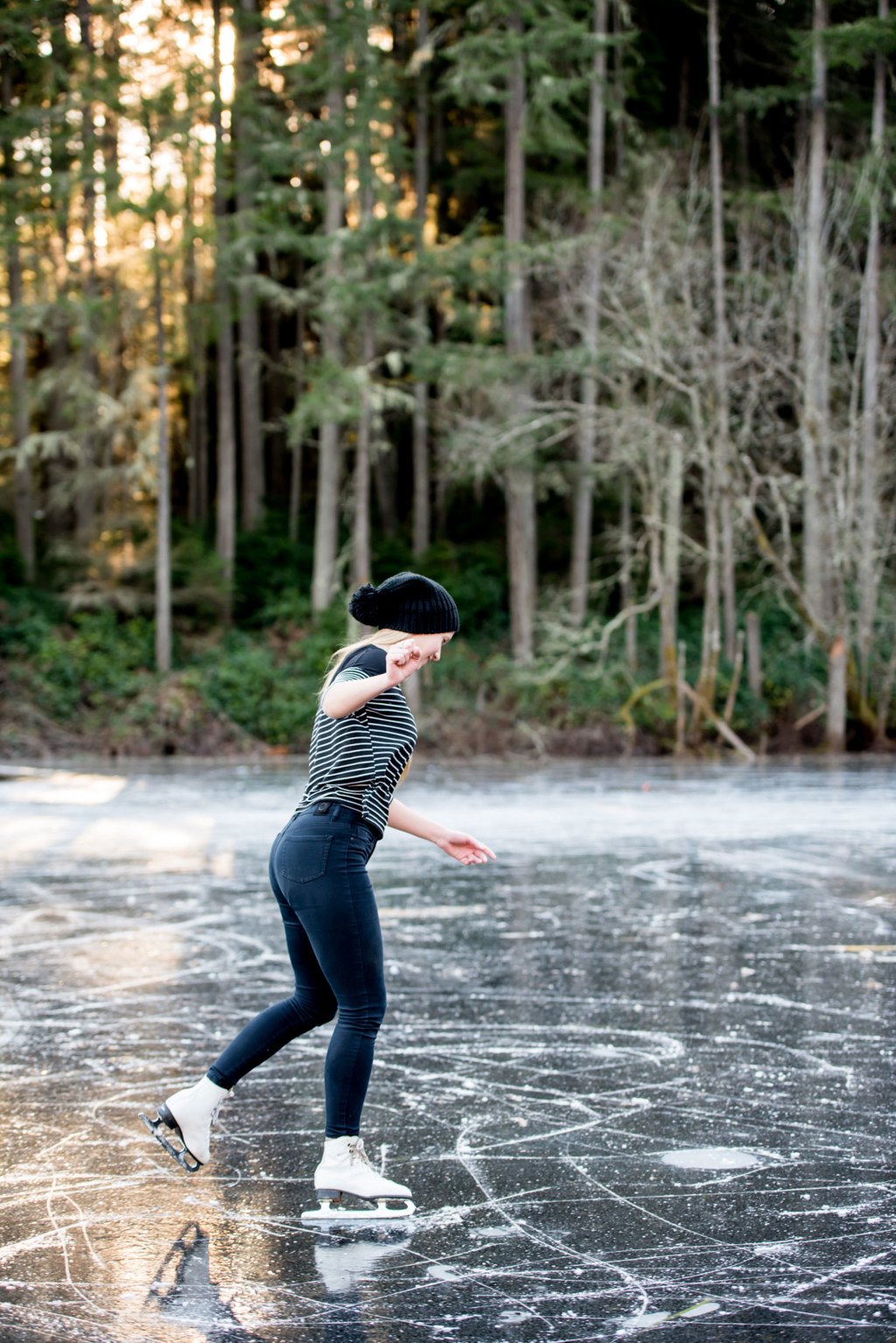 A girl skates along Fisher Pond making new skate tracks. (Cassie Bergman Photo)