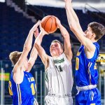 Boys’ basketball team scoops up two important league wins