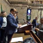 New Lieutenant Governor Cyrus Habib tests out a new Braille system designed to help him preside over the Senate. (Jeanie Lindsay Photo/Northwest News Network)