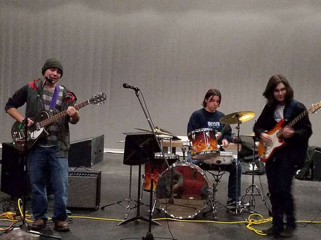 Left to right: Students Joziah Cladoosby, Chick Webb and Isaiah Montemayor of Ouch Pouch rehearse for Sharing the Stage. They will open for Seattle band Tacocat Friday at the Red Bike. (Harris Levinson Photo)
