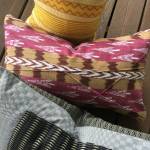 Pillows (and purses, shown in story teaser) commissioned by Priscilla Schleigh and sewn by ReGenr8, will be sold at Giraffe. (Courtesy Photo)