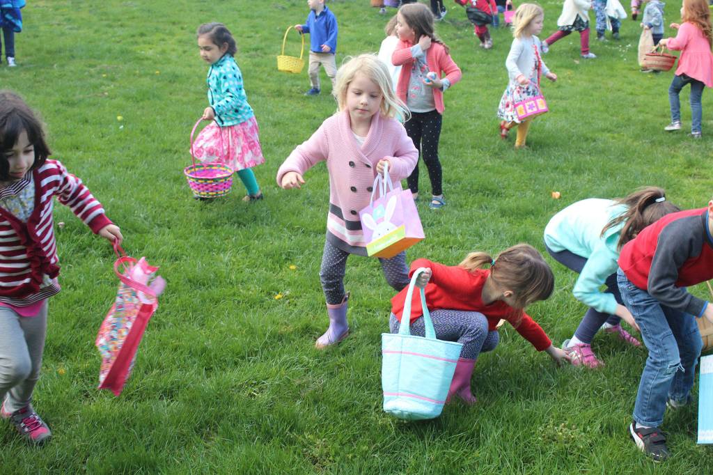 Children scramble to collect as many eggs as they can at the Chamber of Commerce&rsquo;s annual egg hunt. (Anneli Fogt/Staff Photo)