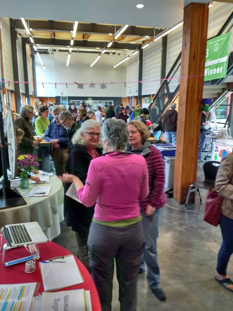 Islanders mingle in Vashon High School&rsquo;s atrium during Sunday&rsquo;s Earth Day Celebration. (Kevin Jones Photo)