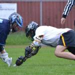Senior Kellan Riley, right, excels at faceoffs, making him an invaluable addition to the team. (Greg Martin Photo)