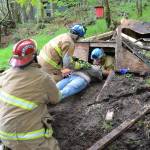 Explorers work together to remove a &ldquo;victim&rdquo; from a collapsed structure at the weekend&rsquo;s Stuck on Vashon event. (Jim Westcott Photo)