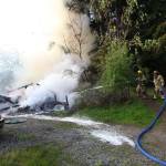 Firefighters work to extinguish the blaze on Westside Highway. (David Weller Photo)