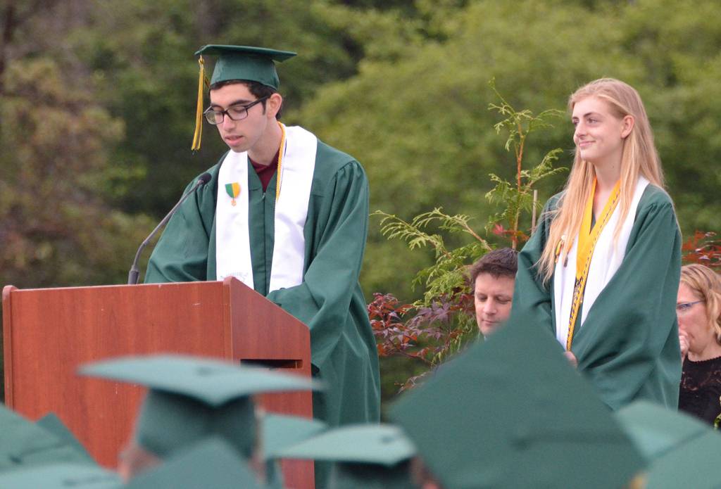 Two Vashon High School students shared the valedictorian title. Aryeh Stahl (at podium) and Aria Garrett both graduated with 4.0 GPAs and gave a speech Saturday about name mispronunciations; appreciation for teachers, families and friends; life lessons; beautiful people and making a difference. (Jim Westcott Photo)