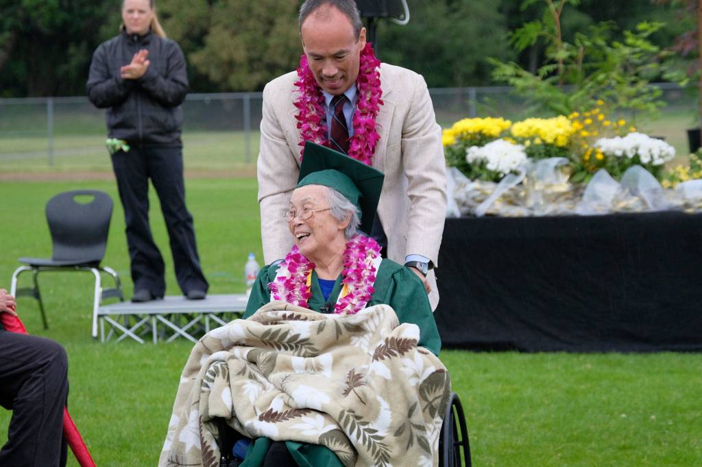 Mary Matsuda Gruenewald and her son, Ray Gruenewald, at the Vashon High School graduation Saturday. Mary received her VHS diploma 74 years after the Japanese-American internment prevented it. (Kent Phelan Photo)