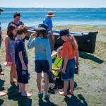 A beach naturalist talks to a group of celebration-goers at Saturday&rsquo;s Low Tide Celebration. (Kent Phelan Photo)