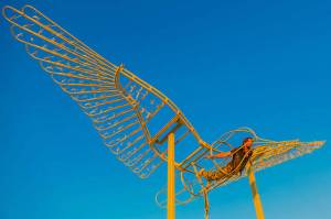Ela Lambin &ldquo;flying&rdquo; in his sculpture created for &ldquo;Interspecies Communication.&rdquo; (Leah Mann Photo)