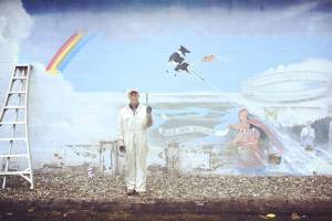 Nearly 40 years after painting original, artist comes back to iconic mural