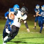 Pirate Connor Hoisington (who was wearing the #10 jersey for the night) finds running room and picks up yardage during a game against the Chimacum Cowboys on Friday in Port Townsend. (Steve Mullensky Photo)