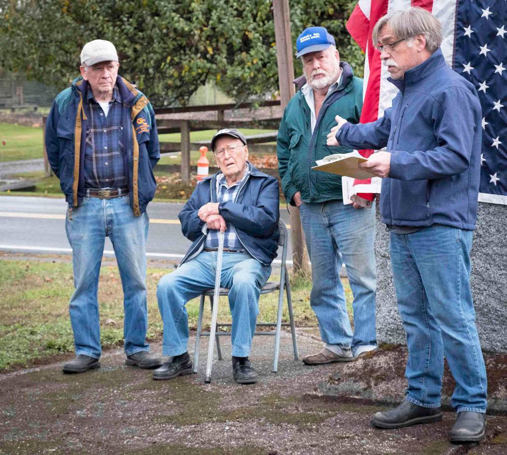 Brian Brenno (far right) introduces Gene Sherman (seated) flanked by his sons Tom Sherman (far left) and John Sherman (second from right). (Terry Donnelly Photo)